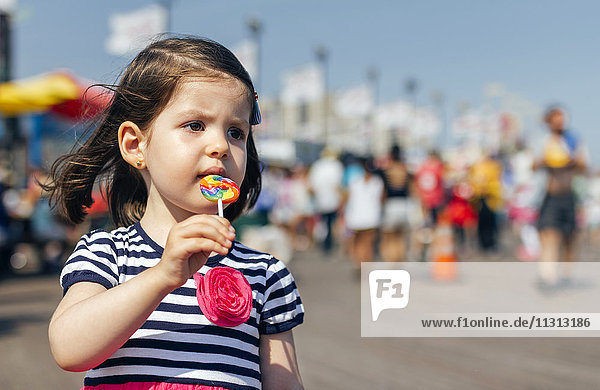 USA  New York  Coney Island  little girl with lollipop