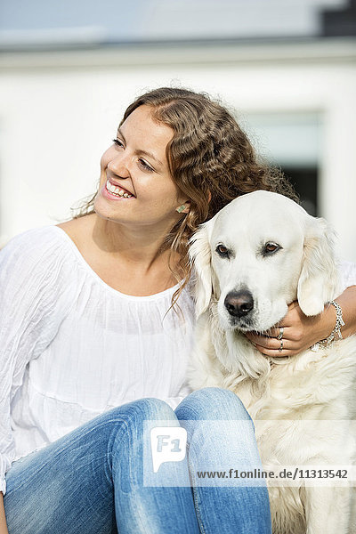 Smiling woman with dog