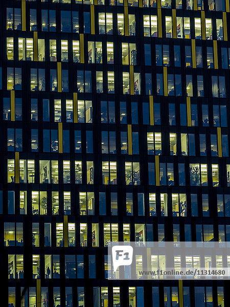 Part of facade of office building in the evening