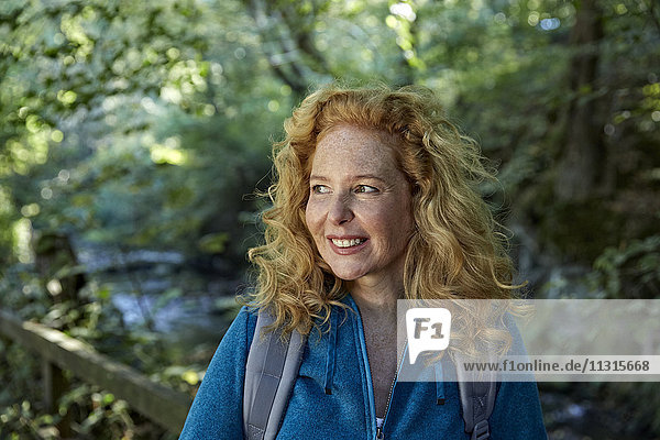 Woman hiking in forest  portrait
