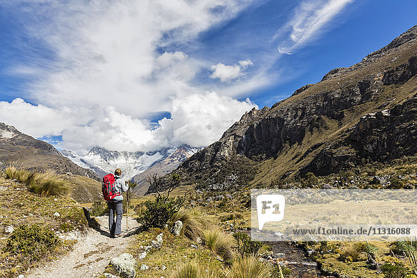 Peru  Andes  Cordillera Blanca  Huascaran National Park  tourist on hiking trail with view to Nevado Huascaran