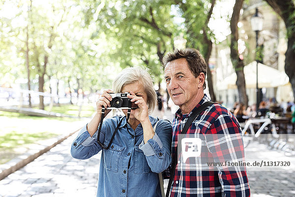 Senior couple with camera