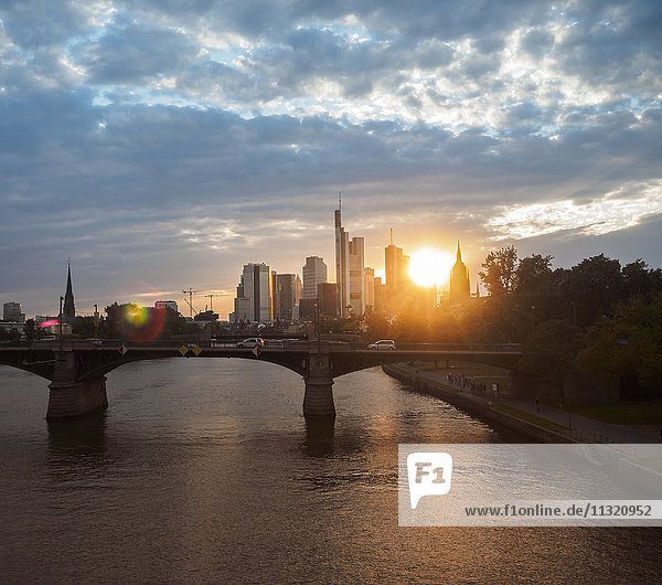 Germany  Frankfurt  view to financial district at sunset with Ignatz-Bubis-Bridge in the foreground