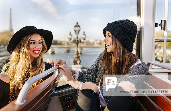 France  Paris  two smiling women on a tour bus