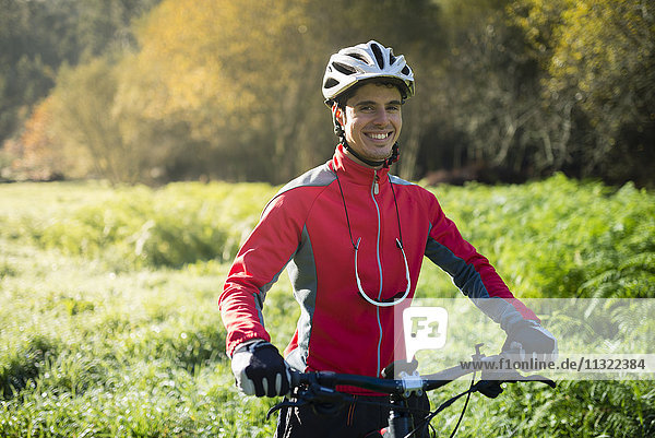 Mountain biker in forest  smiling