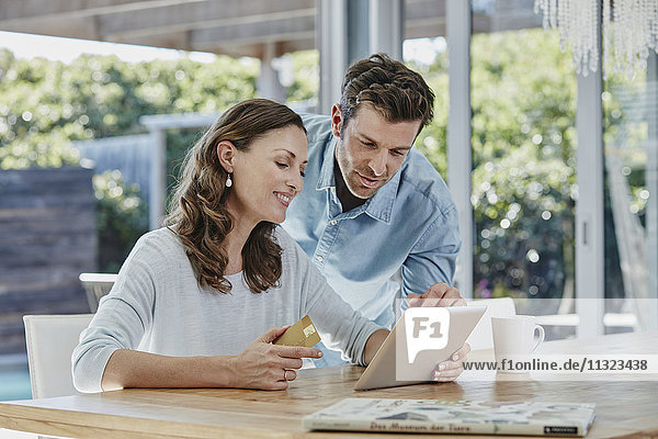 Couple doing online payment with credit card