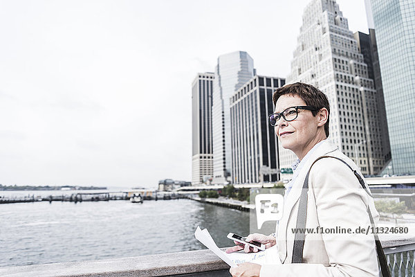 USA  New York  Businesswoman walking in Manhattan