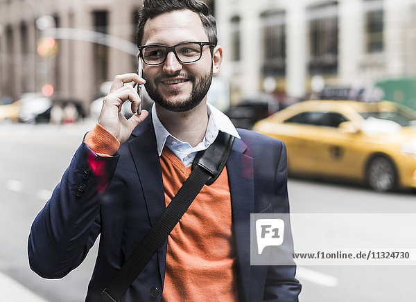 USA  New York City  Businessman using smart phone