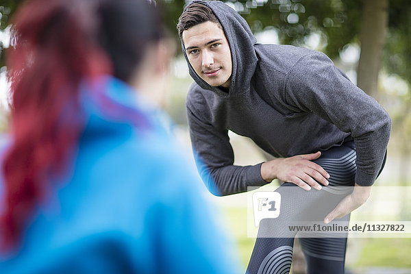 Young man warming up before exercise