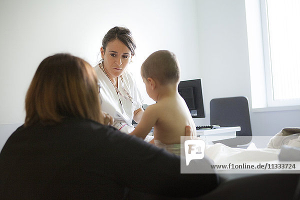 Reportage in the pediatric emergency unit in a hospital in Haute-Savoie  France. A nurse questions the mother of a young boy.