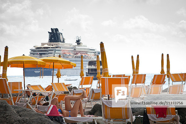 Europe  Italy  Liguria  Santa Margherita  the private beach of Imperiale Palace Hotel with a cruise ship in the background