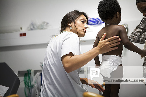 Reportage in the pediatric emergency unit in a hospital in Haute-Savoie  France. A doctor examines a baby.
