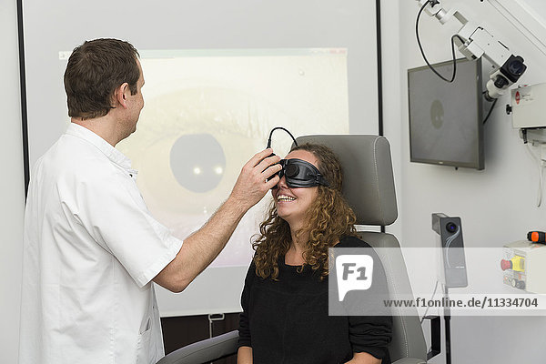 Reportage on an ENT doctor in Nice  France  treating patients suffering from dizziness. A patient during a videonystagmoscopy test. Using a videonystagmoscopy mask that films the eye using infrared  an analysis of the stability of eye movement is carried out  looking for a nystagmus. If the test reveals unstable eye movement in various conditions  this will provide vital information on the origin of the symptoms of dizziness.