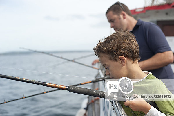 Tourists fish for mackerel on a fishing trip from Penzance  Cornwall  England  United Kingdom  Europe