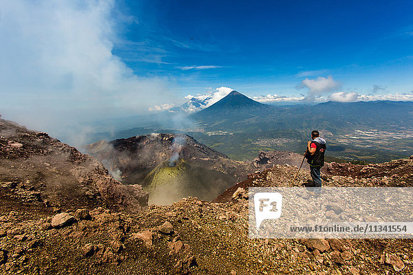 Cresting the peak of Pacaya Volcano in Guatemala City  Guatemala  Central America