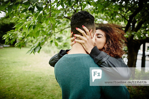 Young couple kissing outdoors