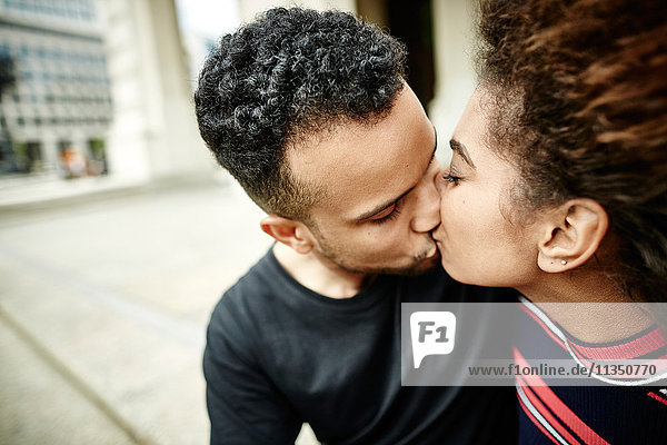 Young couple kissing in the city