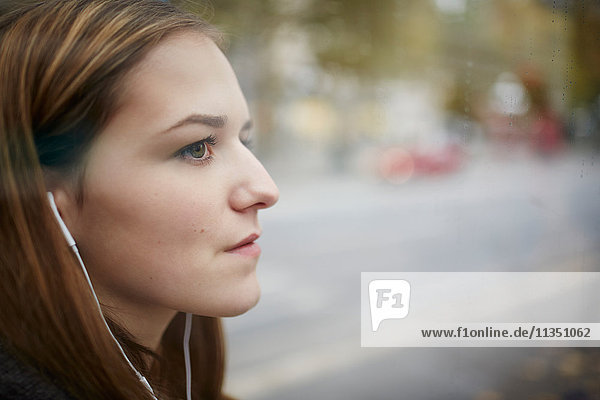 Young woman with earbuds