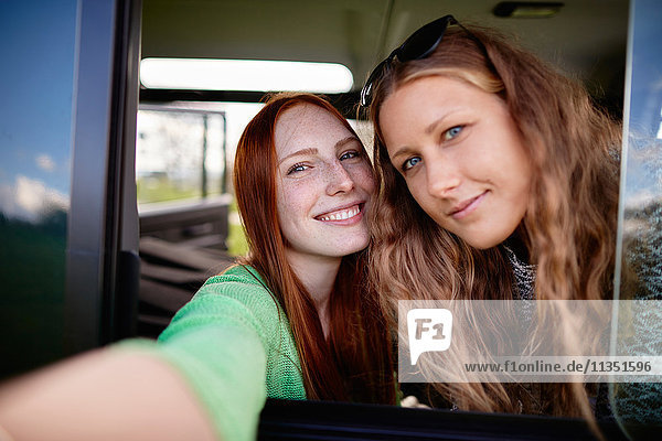 Selfie of two young women in car