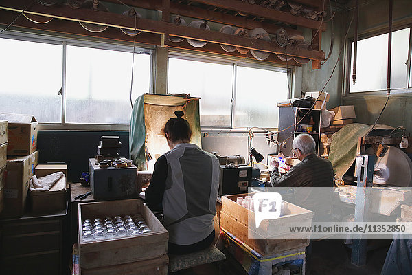 Edo Kiriko traditional Japanese glassware artisans working in the studio
