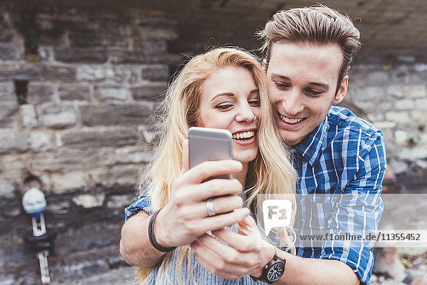 Young couple taking smartphone selfie  Lake Como  Italy