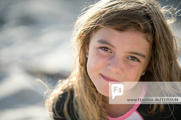 Portrait of young girl at beach  smiling