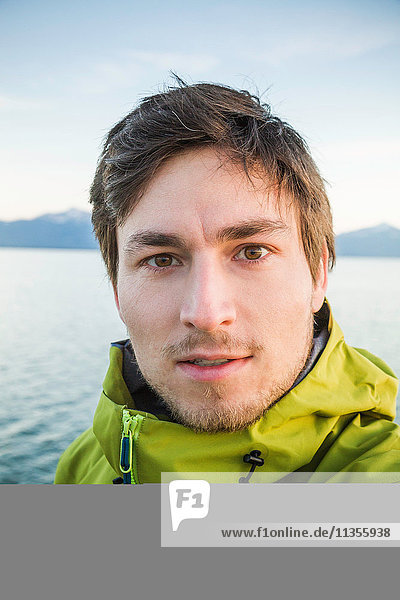 Portrait of man ocean in background