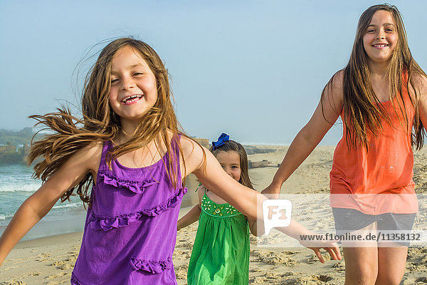 Teenage girl and two sisters on beach  Asbury Park  New Jersey  USA