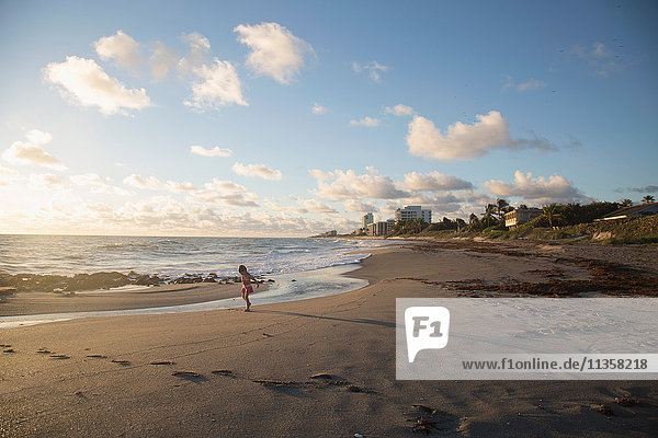 Girl playing on beach  Blowing Rocks Preserve  Jupiter Island  Florida  USA