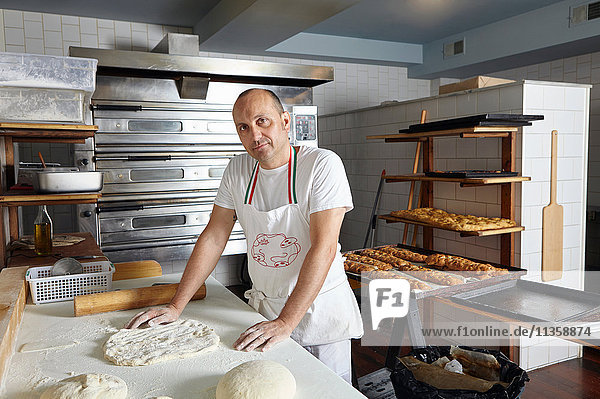 Portrait of baker in bakery