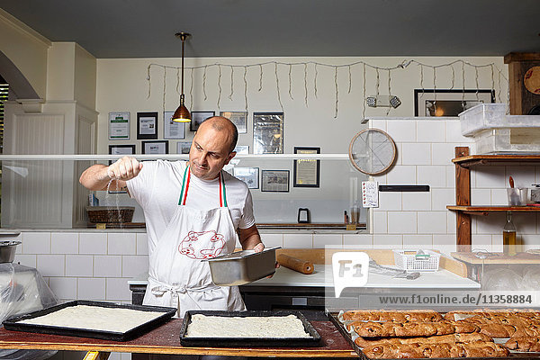Baker working in bakery