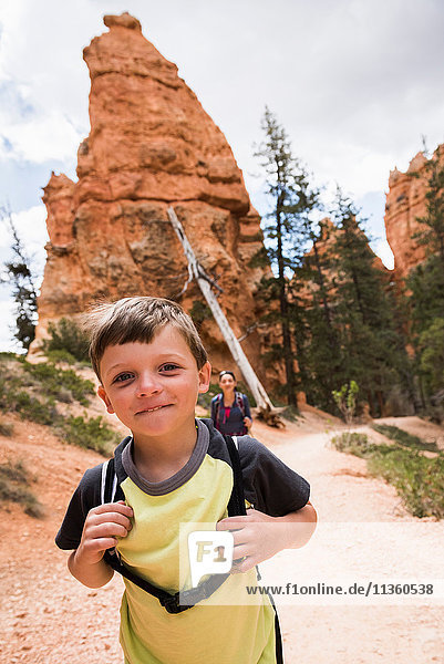 Mother and son  hiking the Queens Garden/Navajo Canyon Loop in Bryce Canyon National Park  Utah  USA