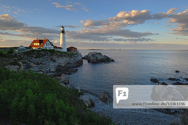 Lighthouse on cliff by ocean  Cape Elizabeth  Portland  Maine  USA