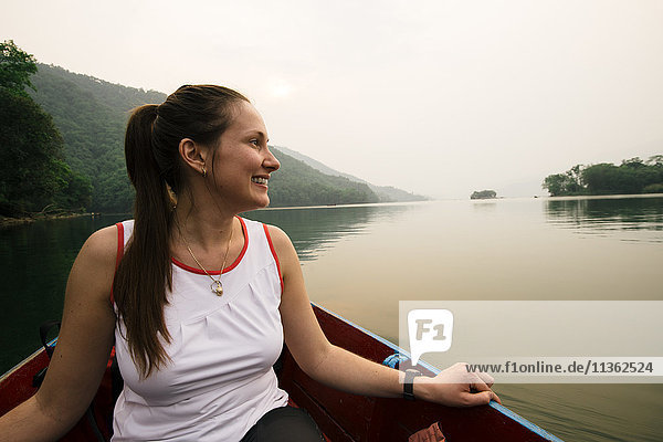 Woman on boat on lake  Pokhara  Nepal