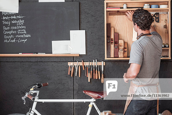 Carpenter at his workshop