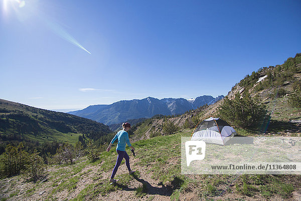 Hiker camping on hilltop  Enchantments  Alpine Lakes Wilderness  Washington  USA
