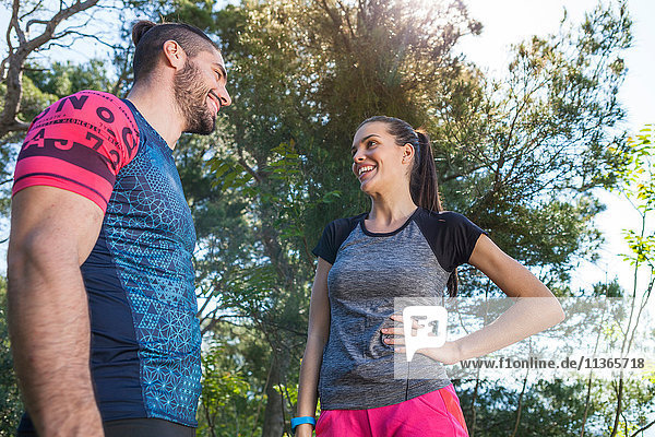 Male and female runners chatting in park  Split  Dalmatia  Croatia