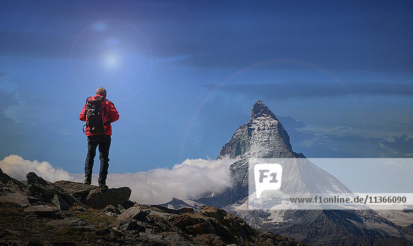 Rear view of senior male climber looking out at Matterhorn  Canton Wallis  Switzerland