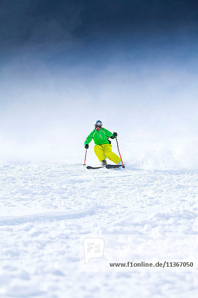 Skier  skiing downhill  low angle view