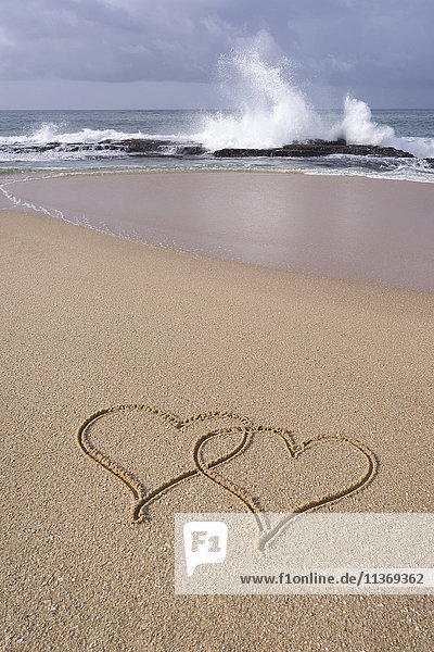 High angle view of hearts shape drawn in sand on beach  Western Province  Sri Lanka