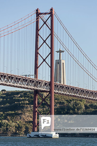 April 25th Bridge across River Tagus and Cristo Rei Statue  Lisbon  Portugal