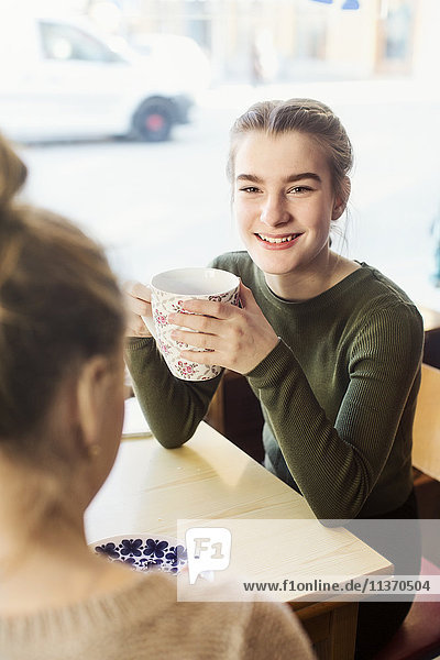 Teenage girls in cafe