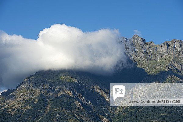 France. Hautes Alpes. Landscape of the Champsaur. Cloud on a mountain in summer