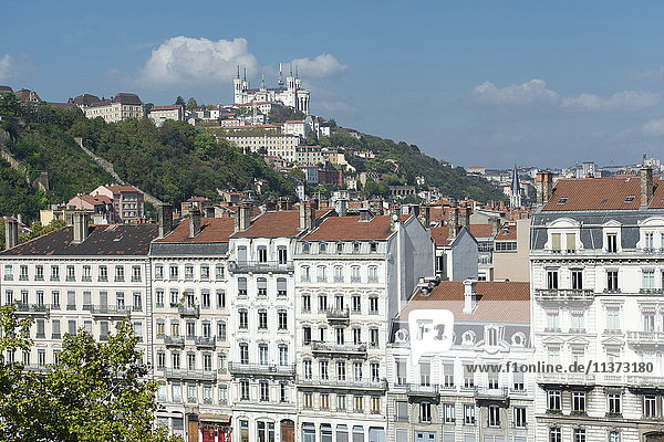France. Lyon. Facades of buildings quay Fulchiron and the basilica Notre-Dame of Fourviere