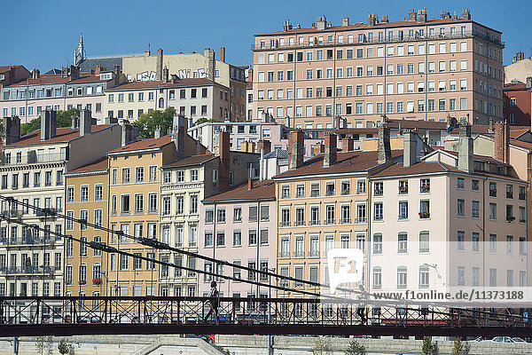 France. Lyon. The footbridge Saint Vincent on the Saone and the facades of the quay Saint Vincent