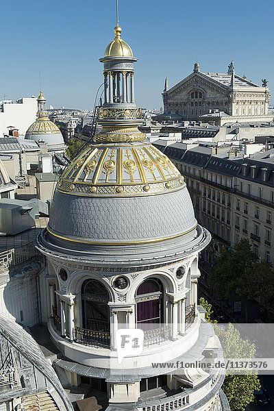 France. Paris 9th district. Turret of the department store Au Printemps. Far off: the Garnier Opera