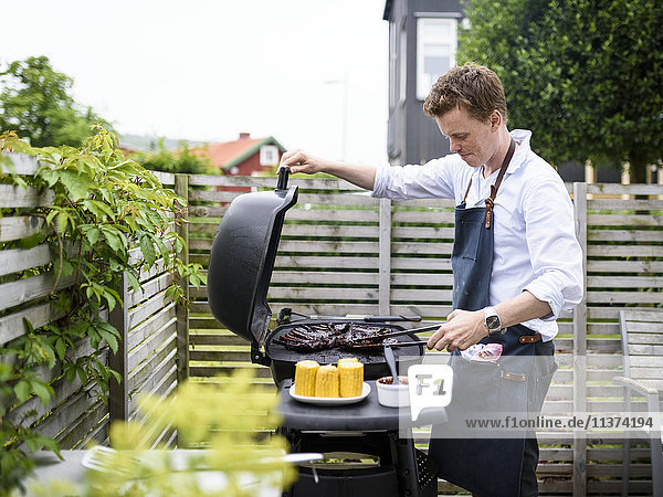 Young man doing barbecue