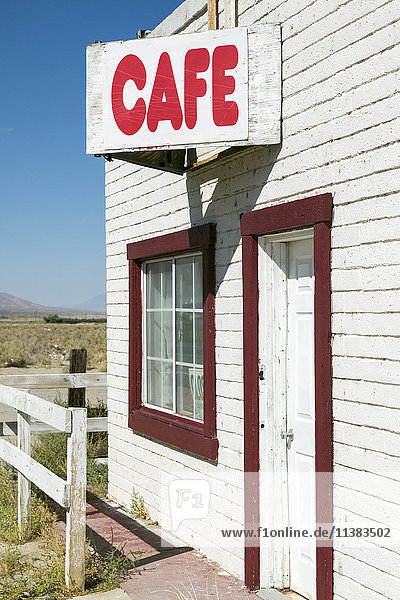 Cafe sign on abandoned building