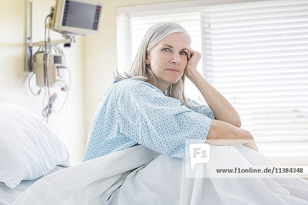 Portrait of frustrated Caucasian woman in hospital bed
