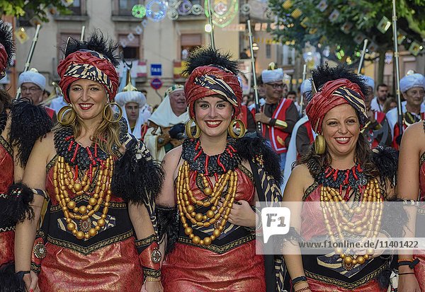 Women in historic clothing  Moors and Christians Parade  Moros y Cristianos  Jijona or Xixona  Province of Alicante  Costa Blanca  Spain  Europe
